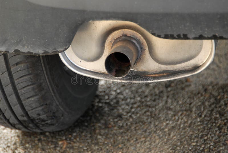 Exhaust pipe of a car stock image. Image of tire, closeup 138033059