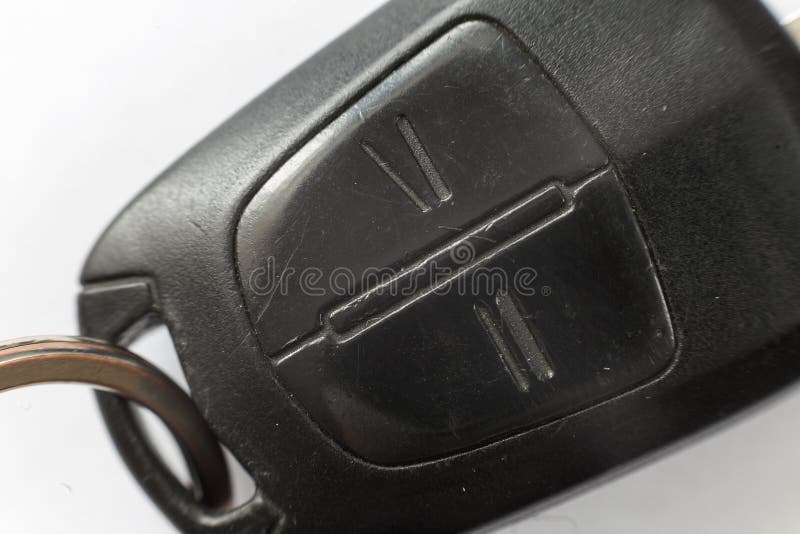 Close-up of car key with remote control buttons on white background. Vehicle lock and keys design, security and transportation stock photos Close-up of car key with remote control buttons on white background. Vehicle lock and keys design, security and transportation stock photos