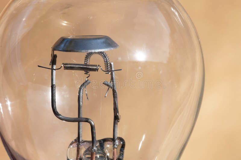 Closeup of a Car Lamp. Filament Bulb for Side Lights and Headlights