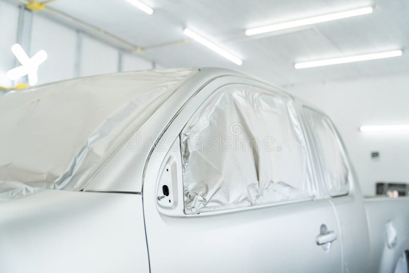 Closeup Car is in the Process of Car Painting in Chamber
