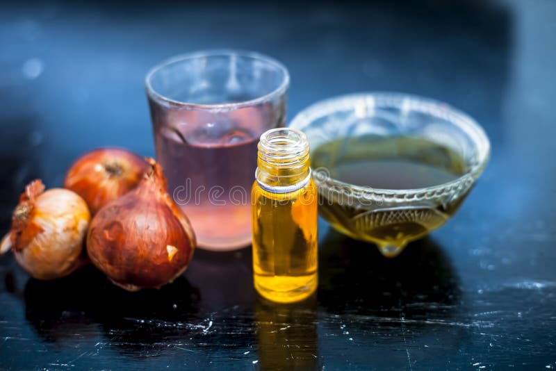 Close Up of Caster Oil,onion Juice Mixture Used To Make Hair Stronger and  Thicker on Wooden Surface Stock Image - Image of luxury, fruit: 174029141