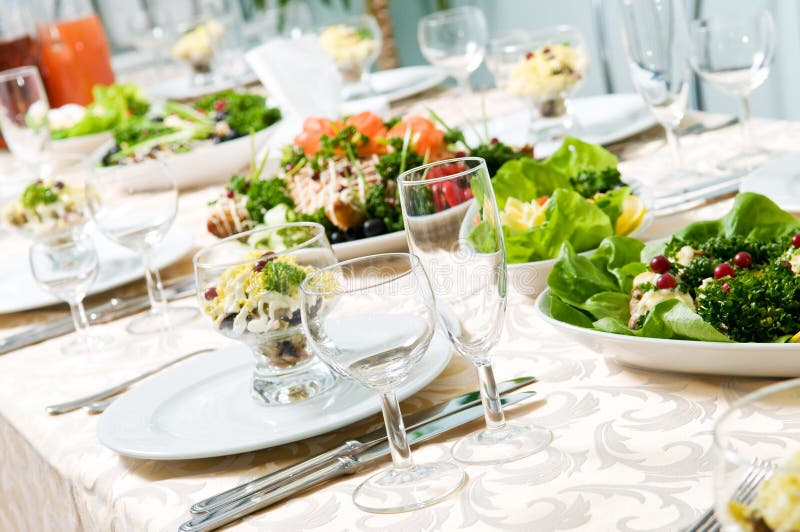 Catering table set service with silverware and glass stemware at restaurant before party. Catering table set service with silverware and glass stemware at restaurant before party