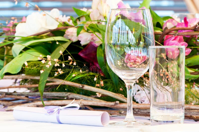 Catering table set service with silverware, fresh flowers and glass at restaurant before party. Catering table set service with silverware, fresh flowers and glass at restaurant before party