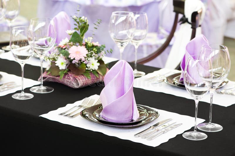 Catering table set service with silverware, napkin and glassware at restaurant. Catering table set service with silverware, napkin and glassware at restaurant