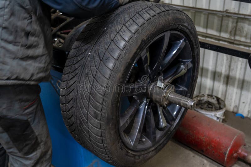 Close Up of Changing Car Tyre. Car Tire Fitting Stock Photo Image of