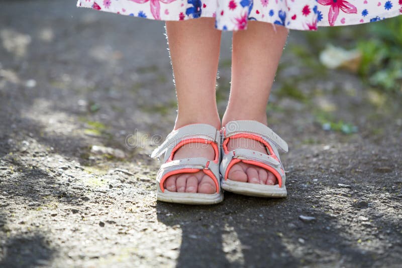 little girl wearing sandals