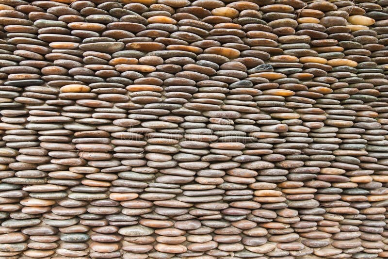 Close up of circle pebble wall