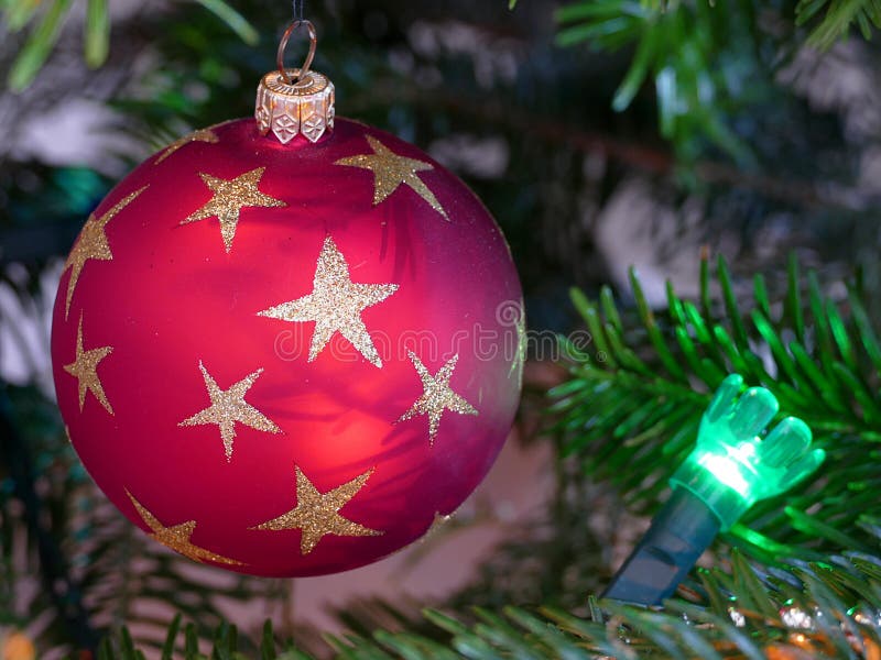 Close Up of a Circular Red Bauble on a Christmas Tree with a Green ...
