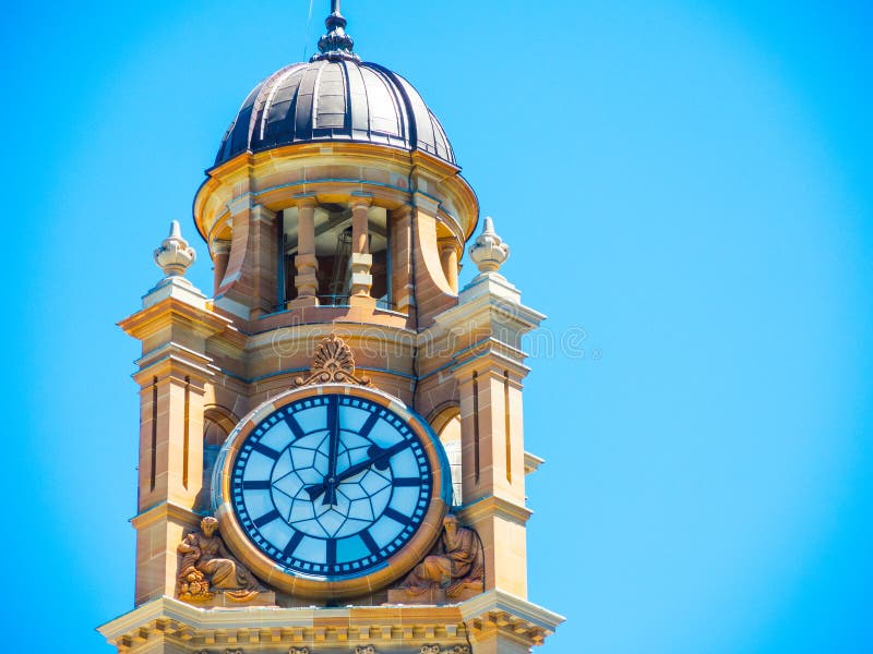 Closeup Clock Tower at Sydney Central Railway Station with Blue Sky at