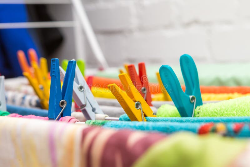 Close up clothes dryer and plastic clips stock image