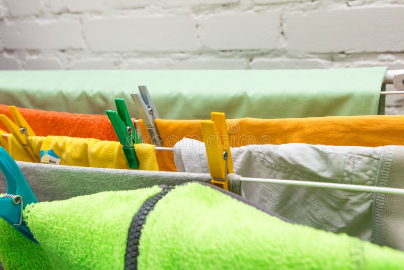 Close up clothes dryer and plastic clips stock image