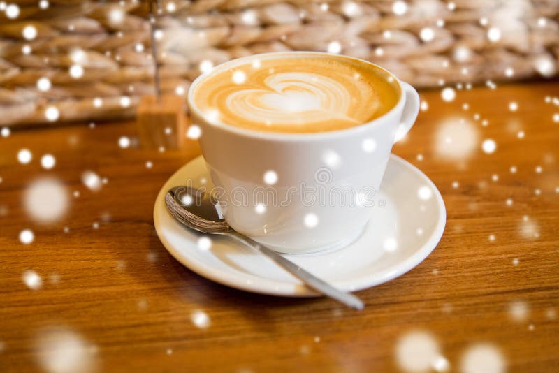 Close up of coffee cup with heart shape drawing