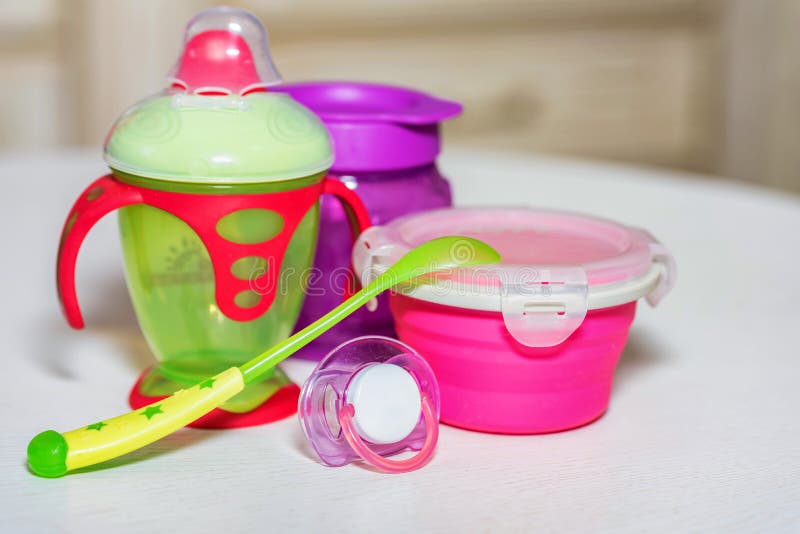 Bright Plastic Baby Dishes on Table Stock Photo Image of picnic