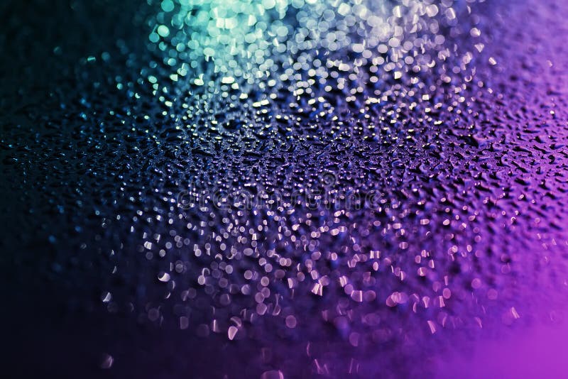 Close up of colorful water drops on the black metal. royalty free stock images Close up of colorful water drops on the black metal. royalty free stock images