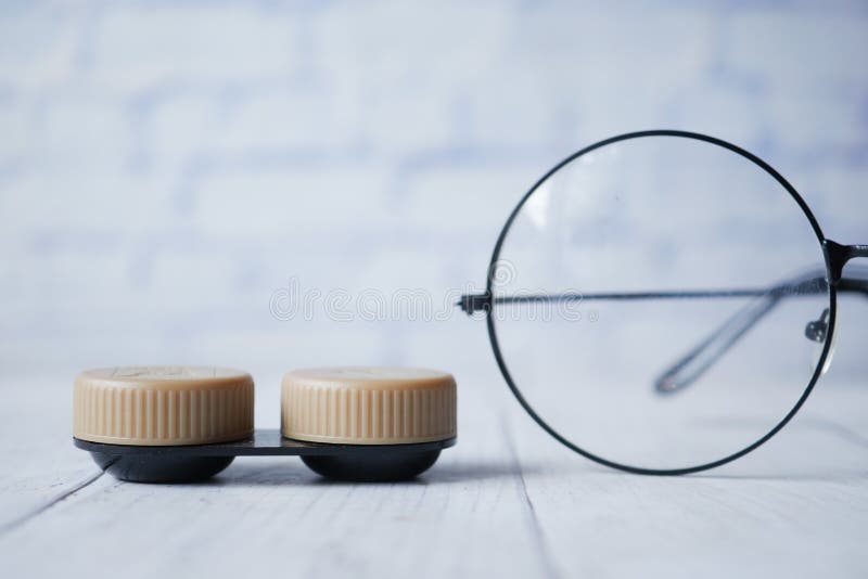 Close Up of Contact Lens and Eyeglass on Table Stock Image Image of
