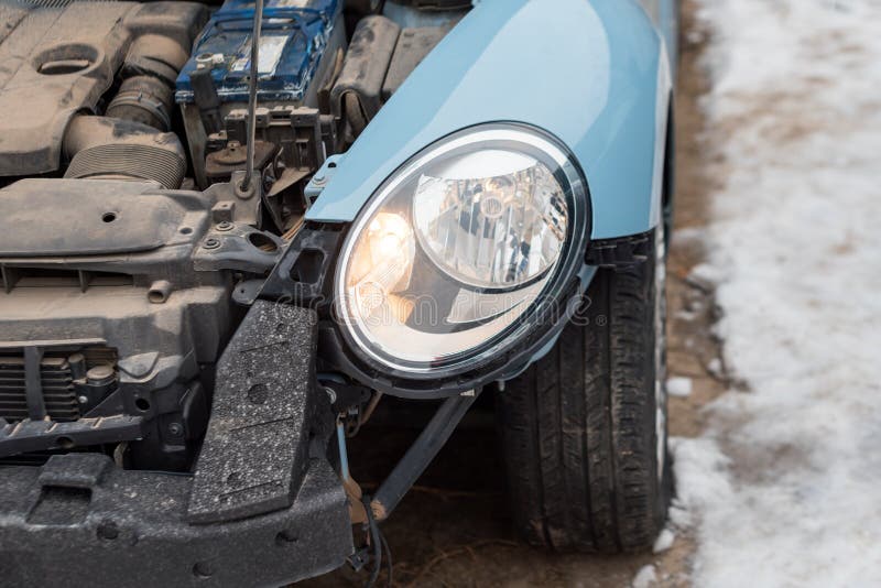 Close up of a crashed car. Auto crash, wreck with damage injury. Street, traffic collision. Broken metal. Automobile.