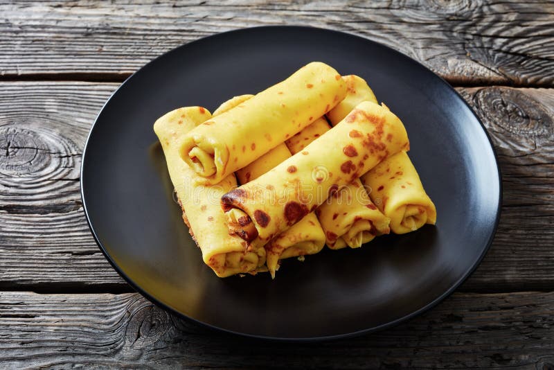 Close-up of crepes rolls with cream cheese filling stock photo Close-up of crepes rolls with cream cheese filling stock photo