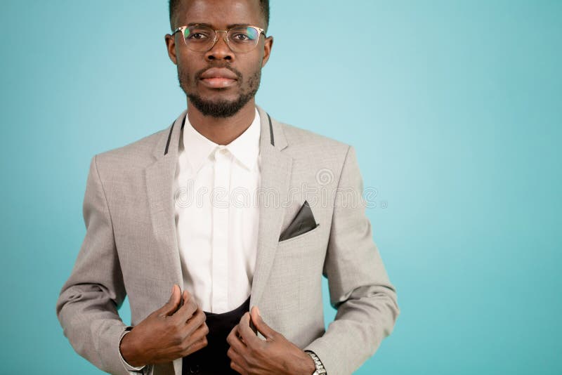 Close up cropped portrait of African business man in white suit isolated stock image Close up cropped portrait of African business man in white suit isolated stock image