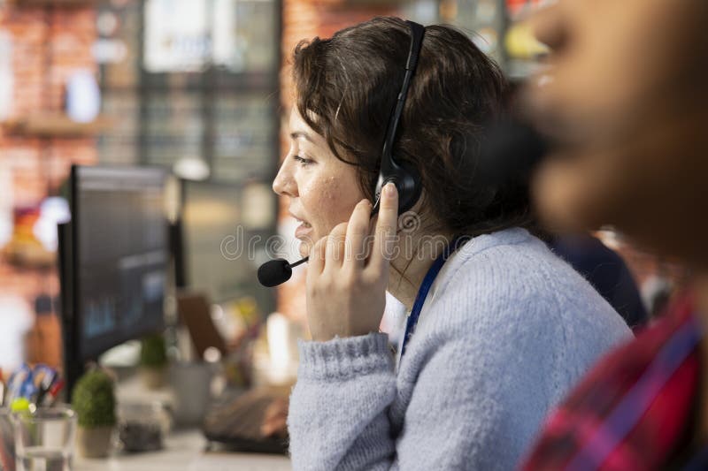 Close up of customer center worker assisting users with installing software royalty free stock photography