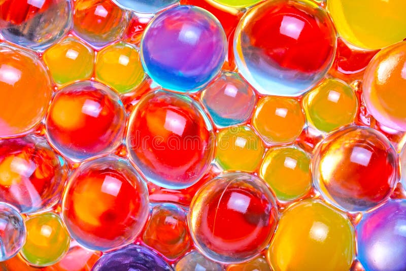 Close-up de grânulos multi-coloridos do hydrogel imagens de stock Close-up de grânulos multi-coloridos do hydrogel imagens de stock