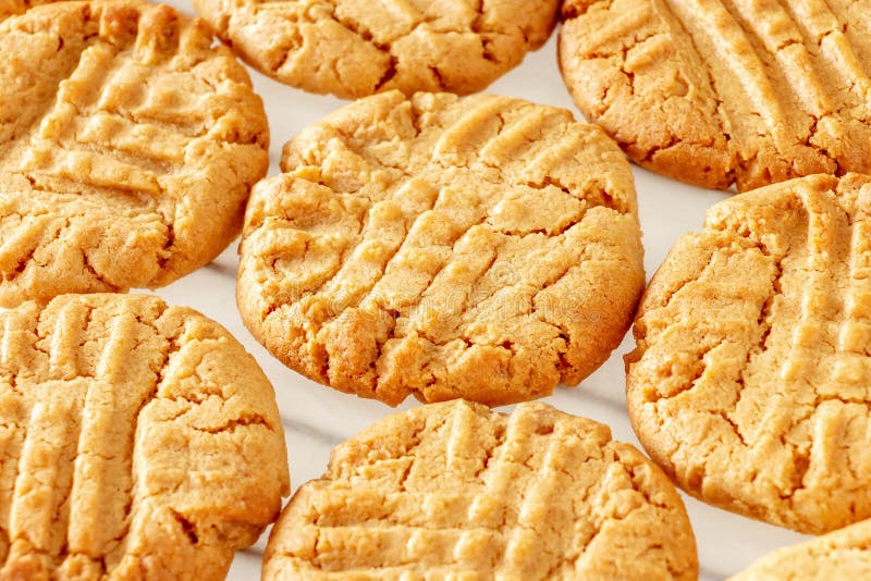 Close up delicious homemade peanut butter cookies on cooling rack. White background. Healthy snack concept. Macro photo.  stock images