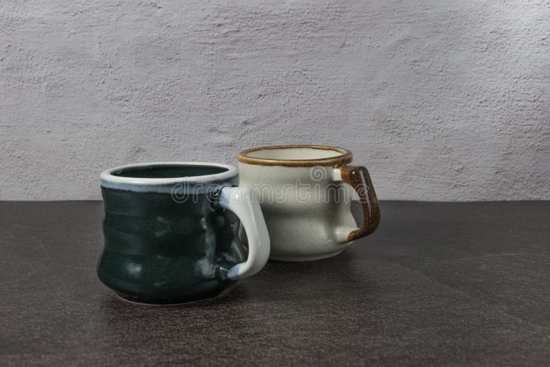 Closeup of Designer Ceramic Mugs. Stock Photo Image of background