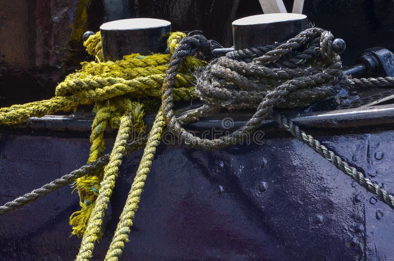 Boat ropes tied to mooring stock photo Boat ropes tied to mooring stock photo
