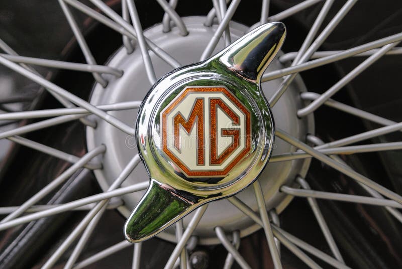 Close up detail of an MG logo on a 2 eared knockoff