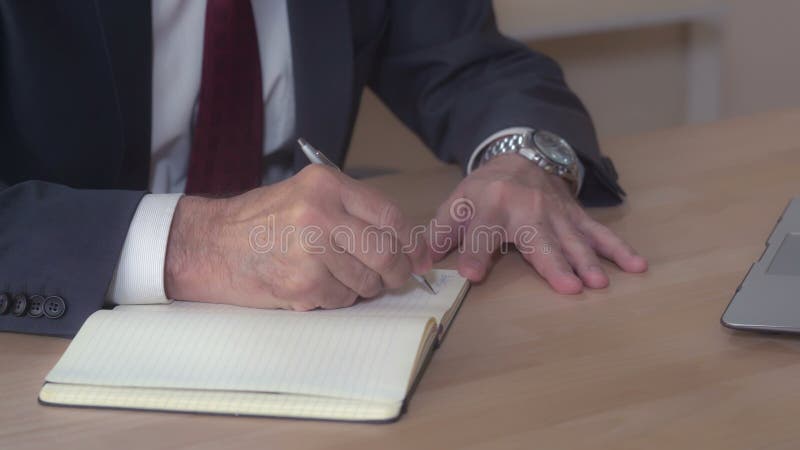 Closeup manager handwriting sits at the desk. stock image Closeup manager handwriting sits at the desk. stock image