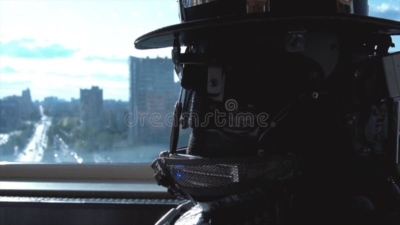 Close-up details of head and shoulders of android. Footage. Details, screws of metal robot man on background of view royalty free stock images