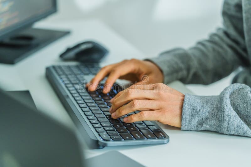 Close up developer hand coding with keyboard on desk at modern office royalty free stock image