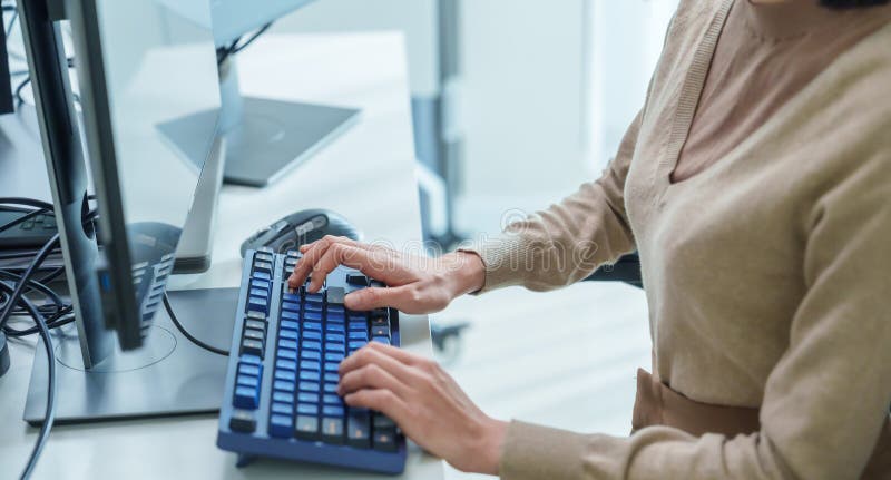 Close up developer hand coding with keyboard on desk at modern office stock photos