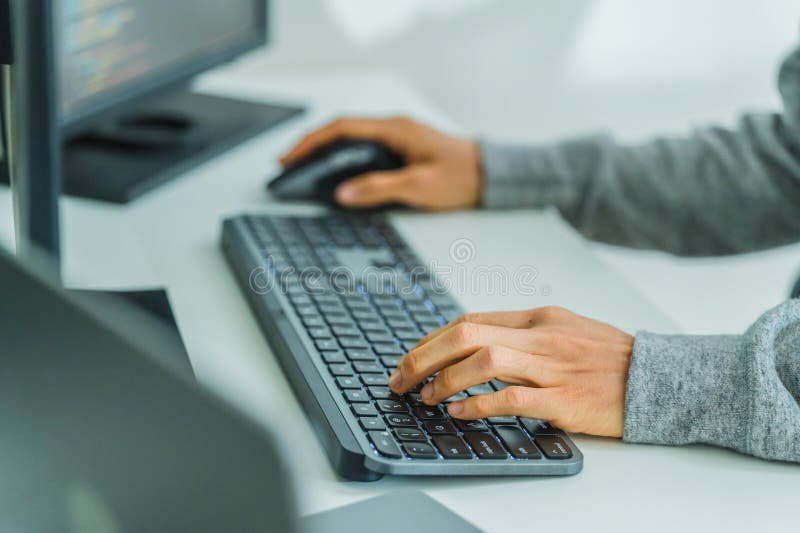 Close up developer hand coding with keyboard on desk at modern office royalty free stock image