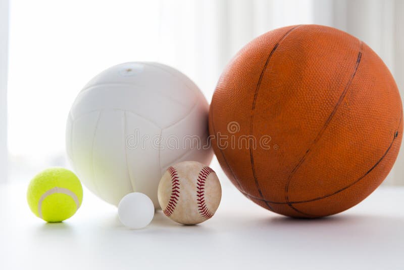 Sport, fitness, game and objects concept - close up of different sports balls set