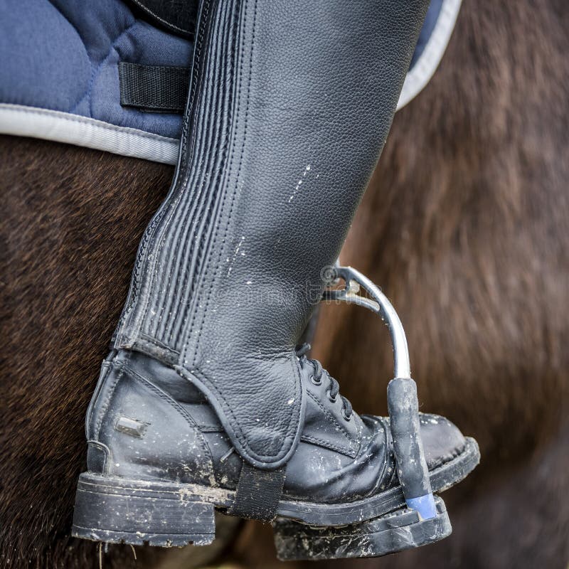 Close up of a dirty riding boot after a ride in the mud