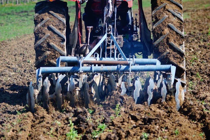 Close up of a disc harrow system, cultivate the soil