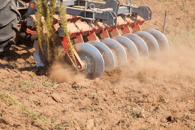 Close up of a disc harrow system, cultivate the soil