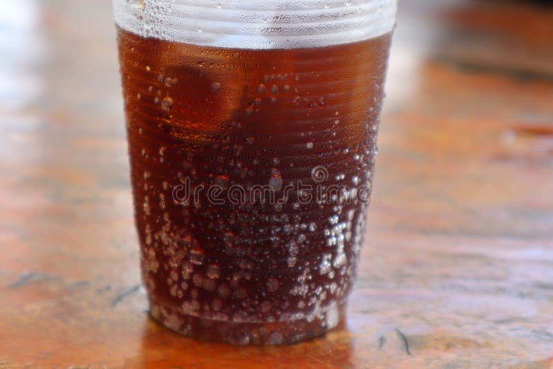 Closeup of Disposable Plastic Drinking Glasses with Ice and Soft