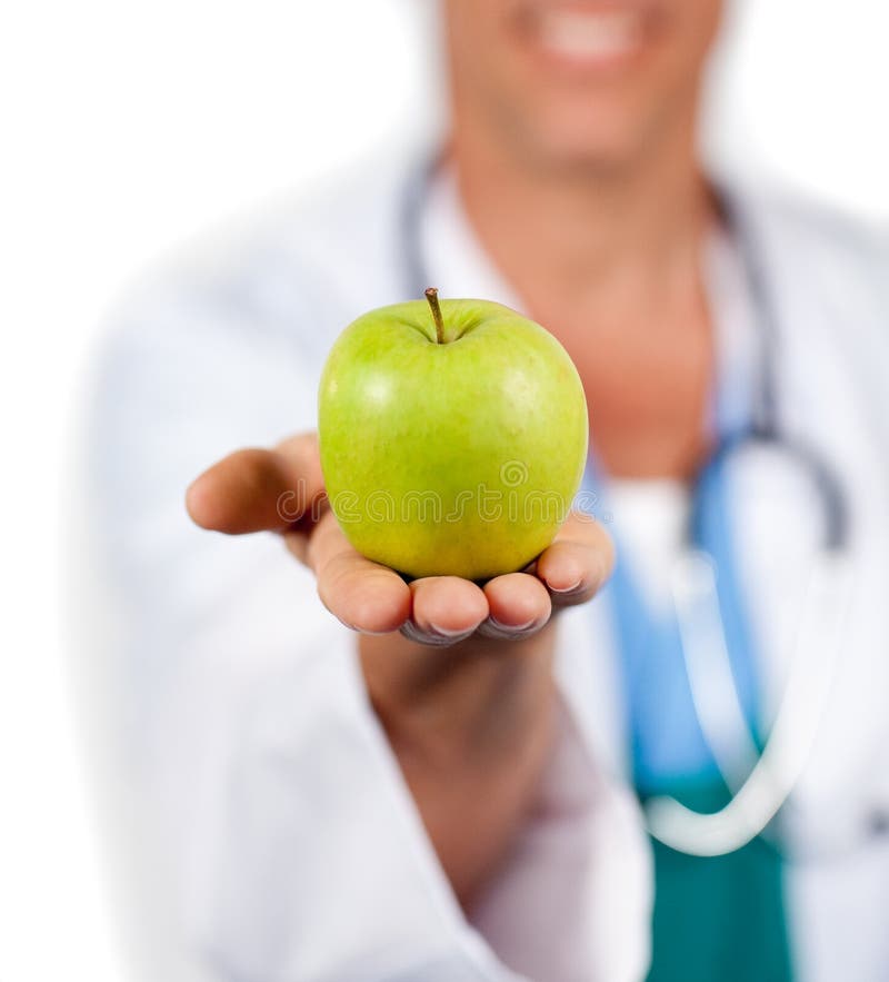 Close-up of a doctor presenting a green apple