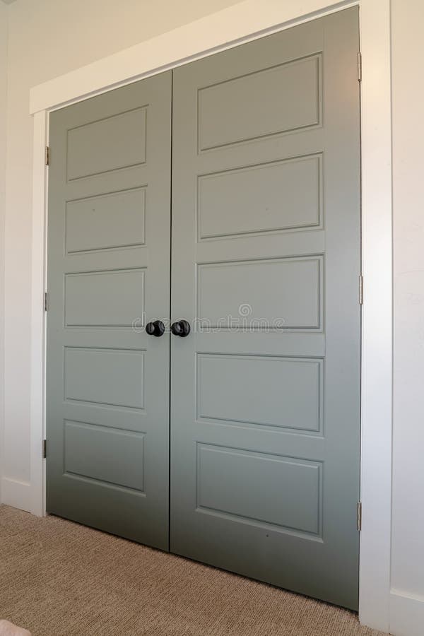 Close Up Of Double Doors With Panels And Matte Black Door Knobs Stock 