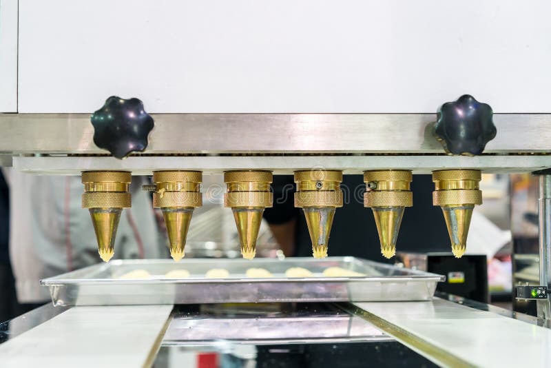Close Up Dough or Cream and Nozzle Discharge of Automatic Biscuit or