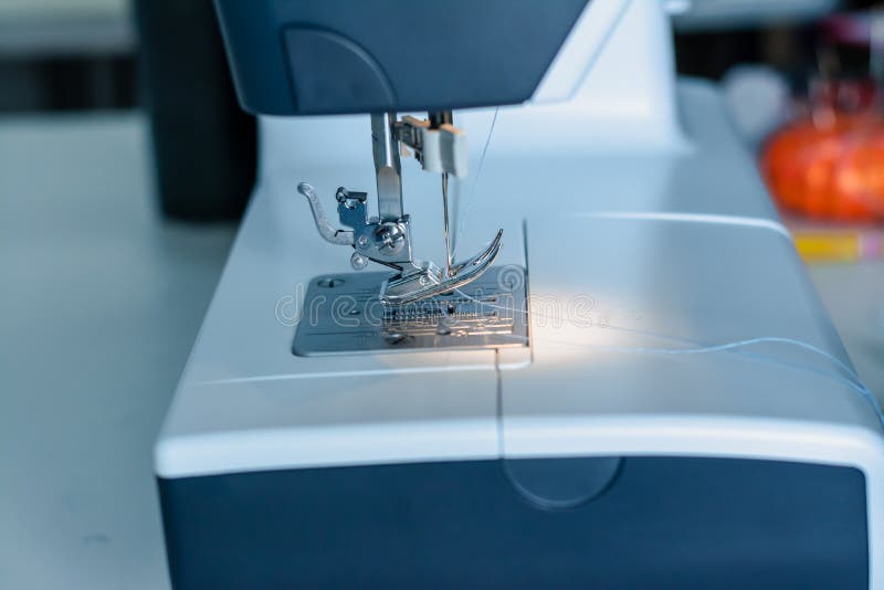 Close Up Dressmaker Is Process Electric Sewing Machine With Fabric And