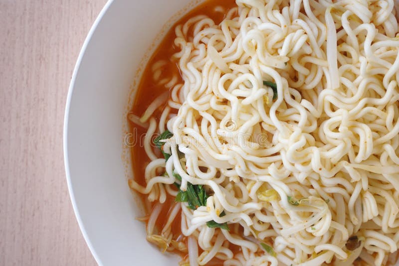 Close up dry tomyum noodle on wooden table