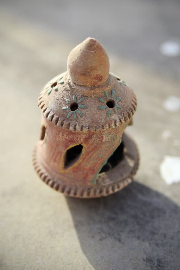 Close-up of earthen candle lamp holder stock images