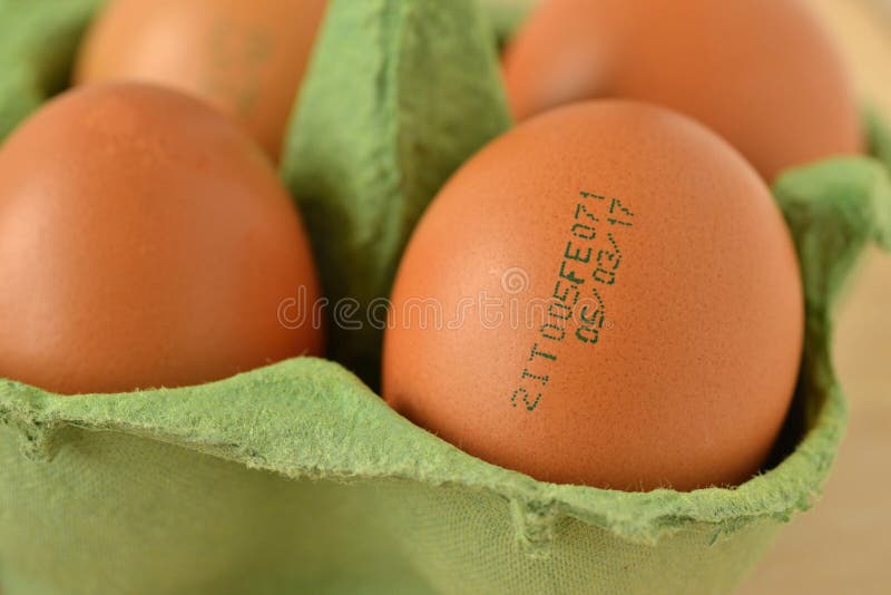 Close-up of eggs with expiration date stock image