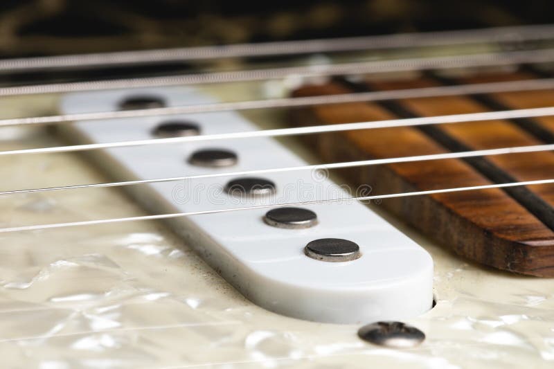 Closeup of Electric Guitar Pickups with Strings. Music Background