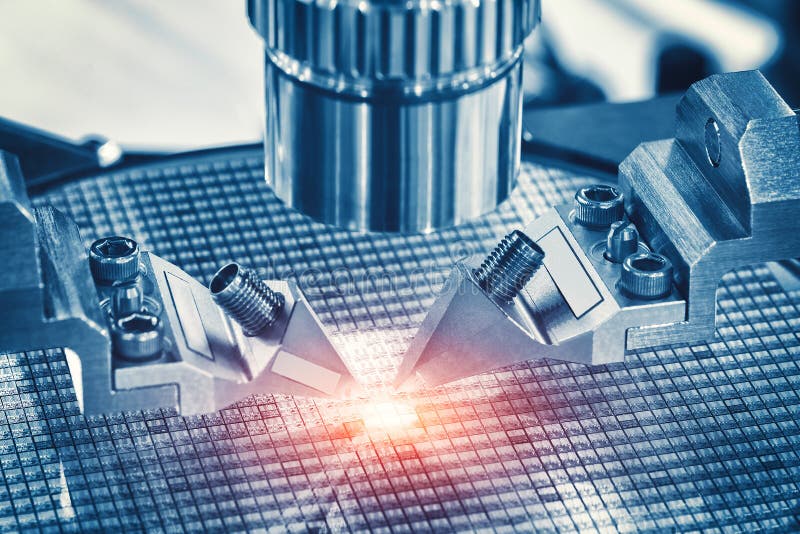 Close up of examining of test sample of microchip transistor under the microscope in laboratory. Equipment for testing microchips. royalty free stock images