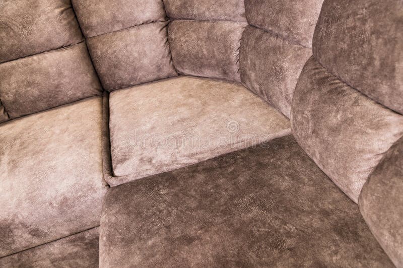 Closeup of an Expensive Soft Textile Sofa of Beige Color with Brown