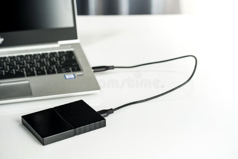 Close up of external hard disk drive for connect to laptop, transfer or backup data between computer and HDD