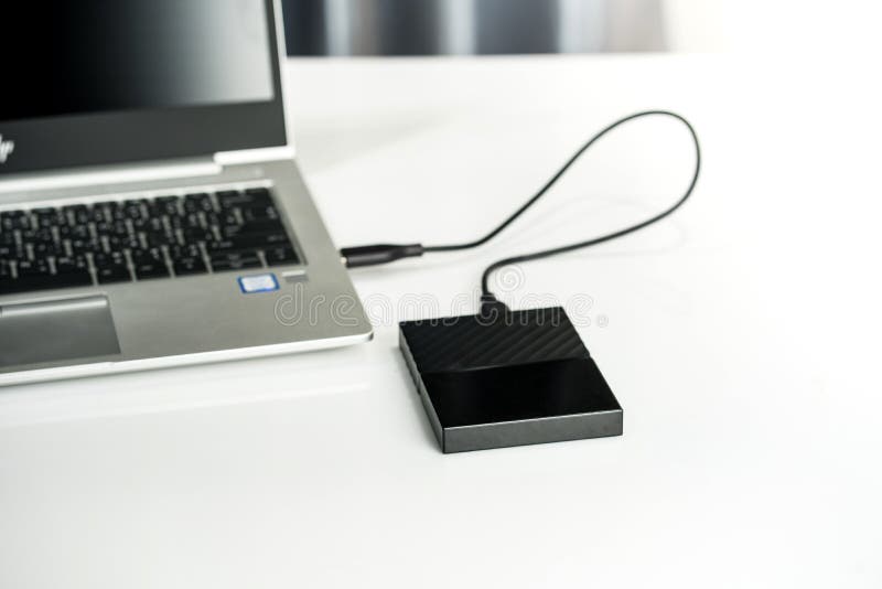 Close up of external hard disk drive for connect to laptop, transfer or backup data between computer and HDD